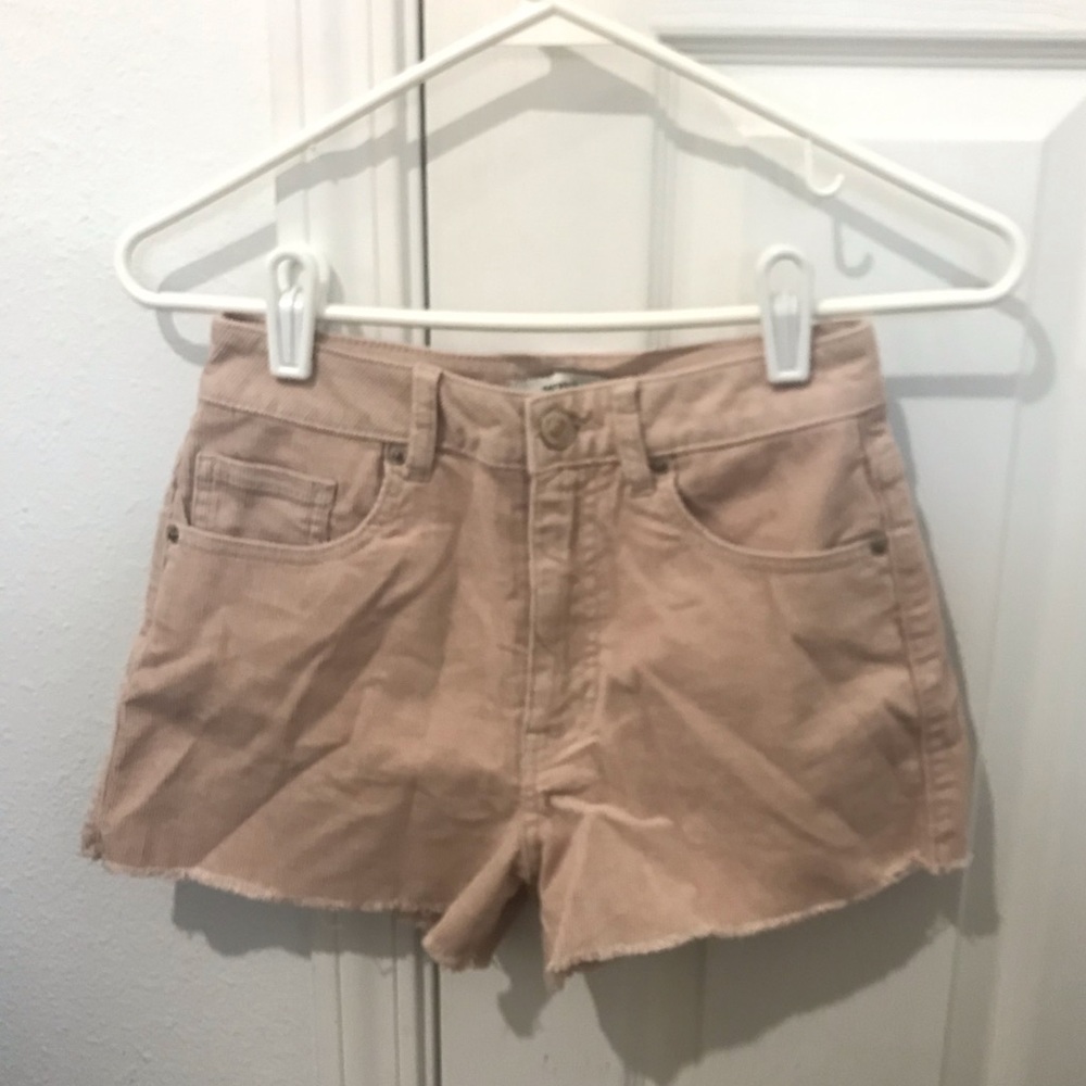 Rose colored high waisted mom shorts.